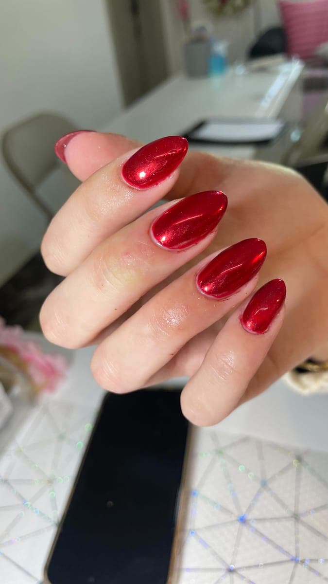 Glossy red chrome almond nails