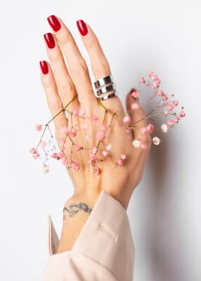 soft-gentle-photo-woman-hand-with-big-ring-red-manicure-hold-cute-little-pink-dried-flowers-white soft-gentle-photo-woman-hand-with-big-ring-red-manicure-hold-cute-little-pink-dried-flowers-white